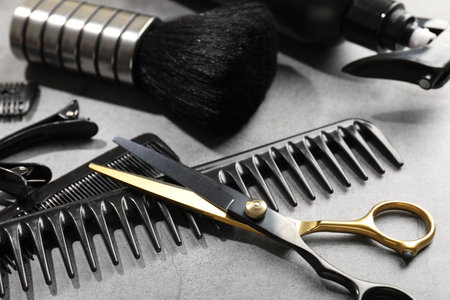 Different hairdresser's tools on grey table, closeupの写真素材