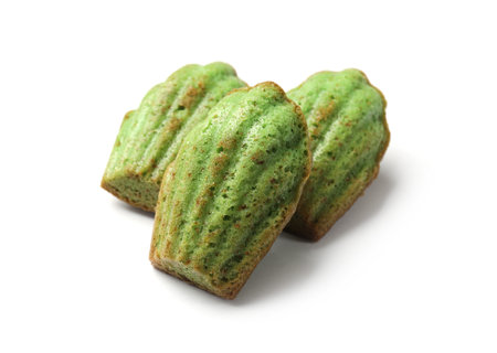 Tasty matcha madeleine cakes isolated on whiteの写真素材