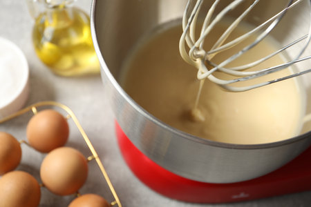 Stand mixer with dough on grey table, closeupの写真素材