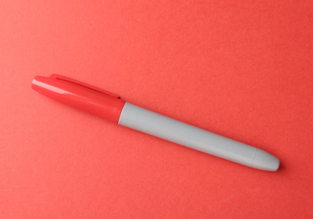 One color marker on red background, top view. Space for textの写真素材