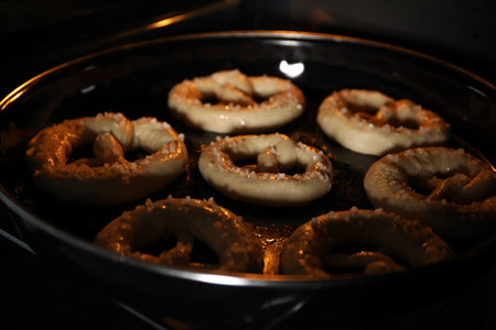 Baking dish with pretzels in oven, closeupの写真素材