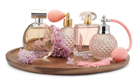 Luxury perfumes and beautiful lilac flowers isolated on white