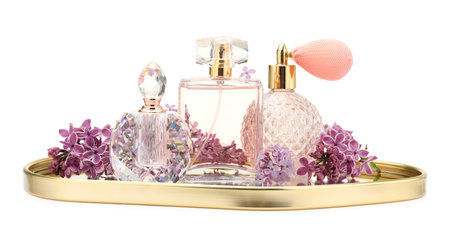 Luxury perfumes and beautiful lilac flowers isolated on whiteの写真素材