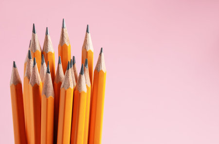 Pencils on pink background, closeup. Space for textの写真素材