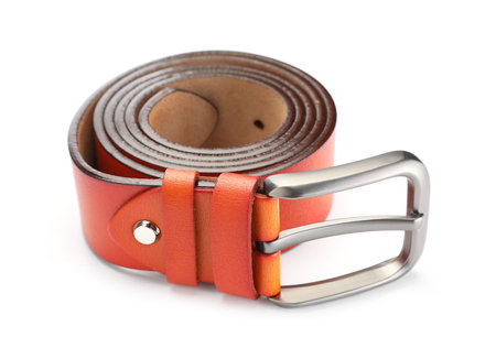 One orange leather belt isolated on whiteの写真素材