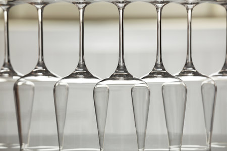 Upturned empty clean glasses on blurred background, closeupの写真素材