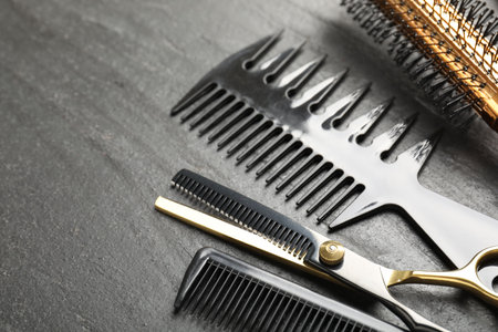 Different barber's tools on black table, closeup. Space for textの写真素材