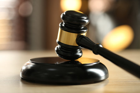 Judge's gavel on wooden table against blurred background, closeupの写真素材