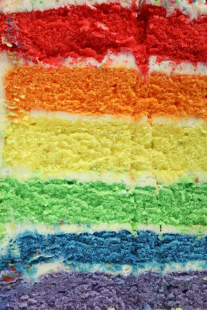 Piece of delicious rainbow cake as background, closeup