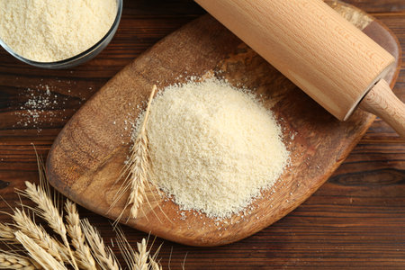 Pile of flour on wooden table, flat layの写真素材