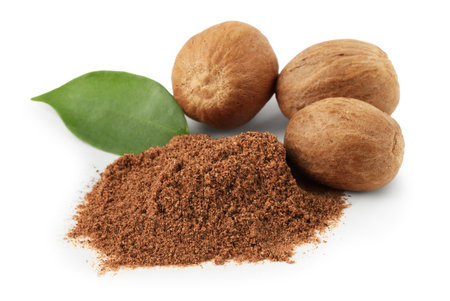 Whole nutmegs, powder and leaf isolated on whiteの写真素材