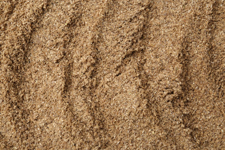 Superfood. Coriander powder as background, top viewの写真素材