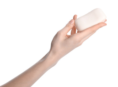 Woman with soap bar on white background, closeupの写真素材