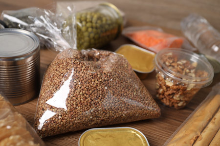 Different food products on wooden table, closeupの写真素材