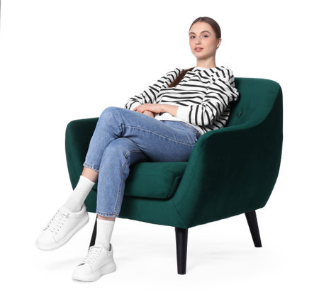 Beautiful woman relaxing in comfortable armchair on white backgroundの写真素材