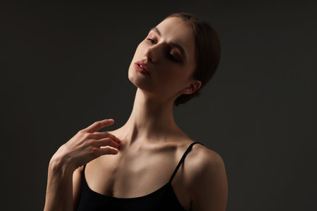 Beautiful woman with perfect skin on grey backgroundの写真素材