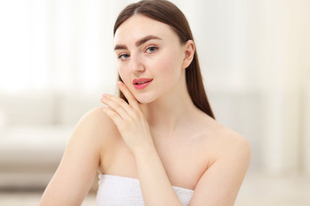 Portrait of woman with healthy skin on blurred backgroundの写真素材