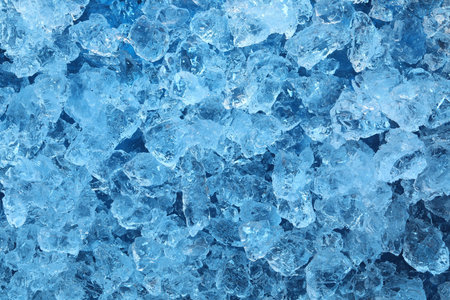 Cubes of clear ice as background, closeup