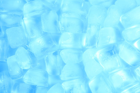 Cubes of clear ice as background, top view