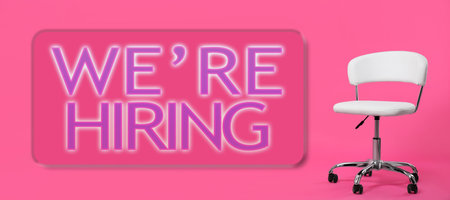 Empty office chair on pink background, banner.の写真素材