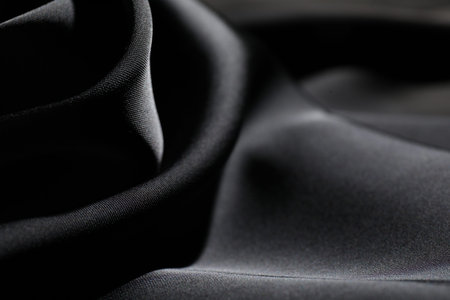 Crumpled black silk fabric as background, closeupの写真素材