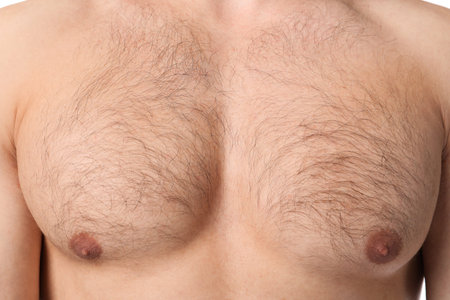 Young man with hairy chest, closeup. Epilation procedure