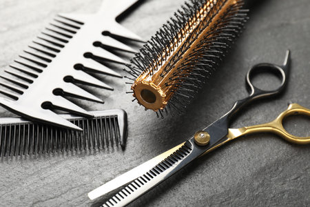 Different barber's tools on black table, closeupの写真素材