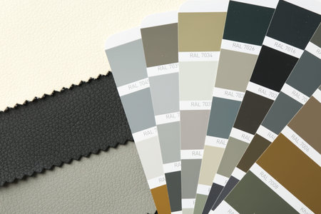 Samples of colorful fabrics and color palettes, top view