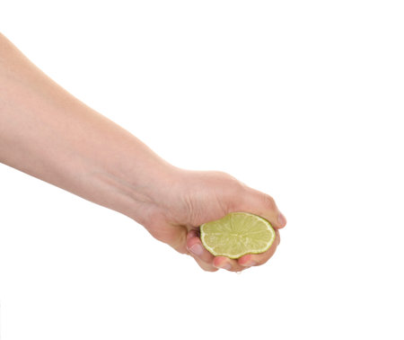 Woman squeezing lime on white background, closeupの写真素材
