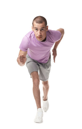 Man in sportswear running on white background