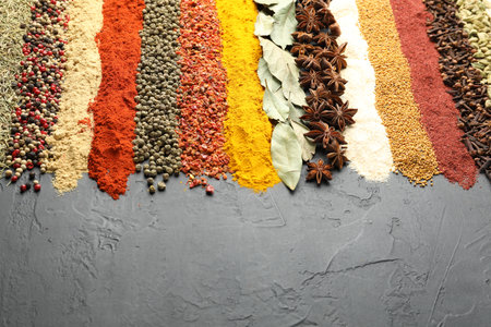 Many different spices on black table, closeup. Space for textの写真素材