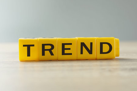 Word Trend made of yellow cubes with letters on tableの写真素材