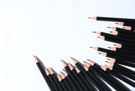 Many sharp graphite pencils on white background. Space for textの写真素材