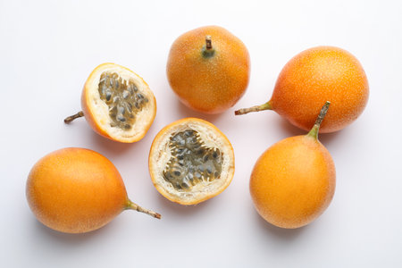 Ripe passion fruits on white background, flat layの写真素材