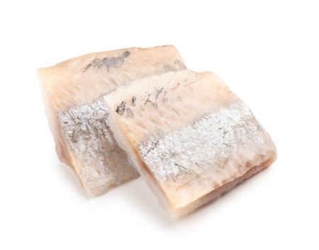 Pieces of delicious herring isolated on white