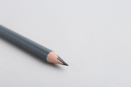 Grey eyebrow pencil on light background, closeup.の写真素材