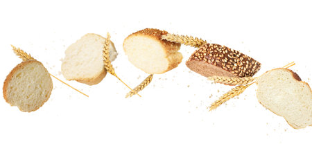 Pieces of baguettes and spikes in air on white background. Banner designの写真素材