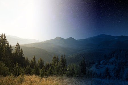 Beautiful mountains with forest by day and night, combined designの写真素材