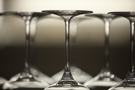 Upturned empty clean glasses on blurred background, closeupの写真素材