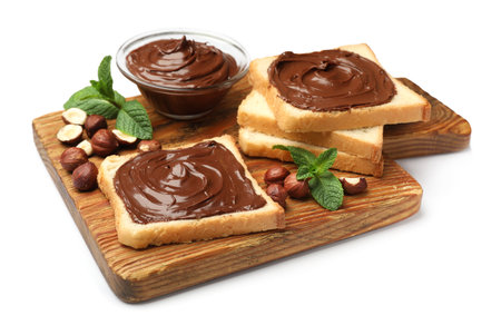 Toasts with chocolate hazelnut spread, nuts and mint isolated on whiteの写真素材