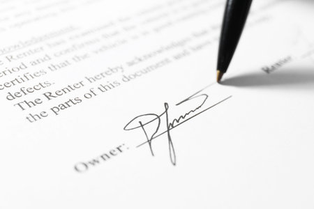Pen leaving signature on contract, closeup view
