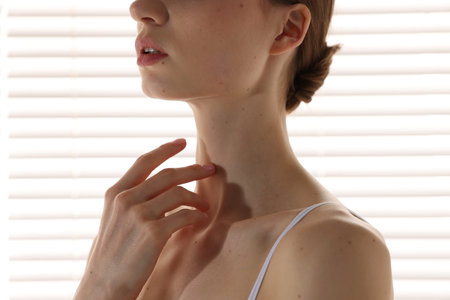 Woman with perfect skin at home, closeup