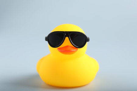 Cute rubber duck with sunglasses on white background, closeupの写真素材