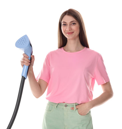 Beautiful woman with clothes steamer on white backgroundの写真素材