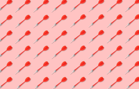Pattern of darts on light red backgroundの写真素材