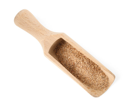 Nutmeg powder in scoop isolated on white, top viewの写真素材