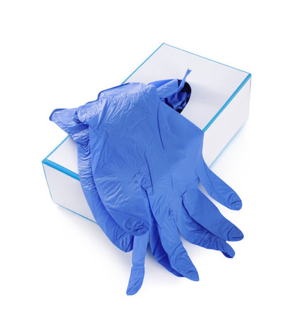 Blue medical gloves and box isolated on whiteの写真素材