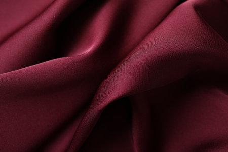 Crumpled burgundy silk fabric as background, closeupの写真素材