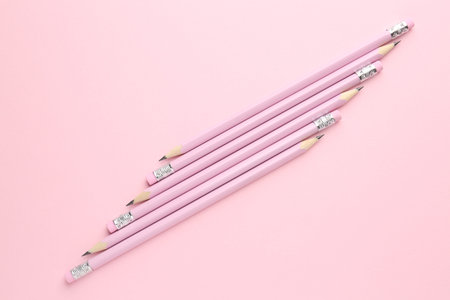 Many graphite pencils on pink background, flat layの写真素材