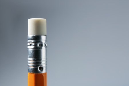 One pencil with eraser on grey background, closeup. Space for textの写真素材